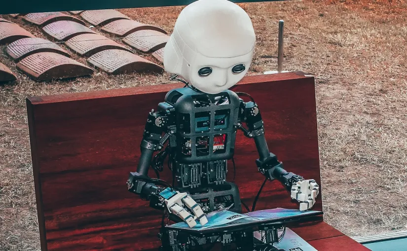 Robot som läser eller skriver.